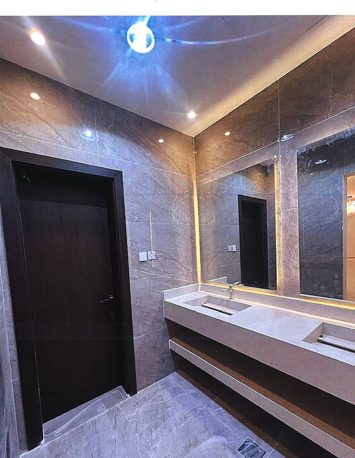 Grey-marble bathroom with double vanity