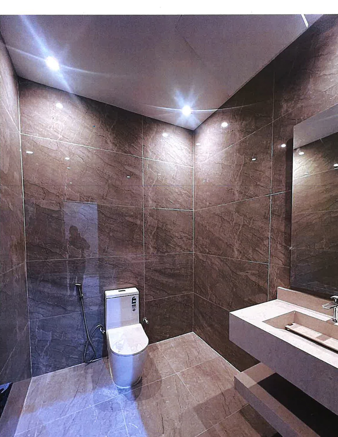 Brown-marble powder room