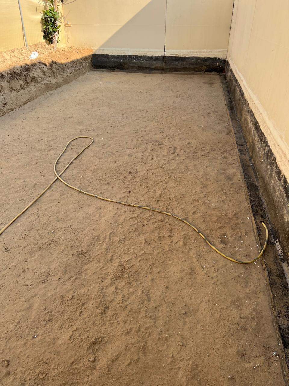Empty excavated plot before construction
